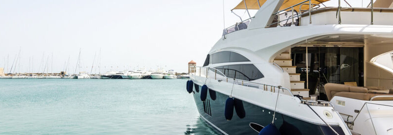 blue and white yacht on water